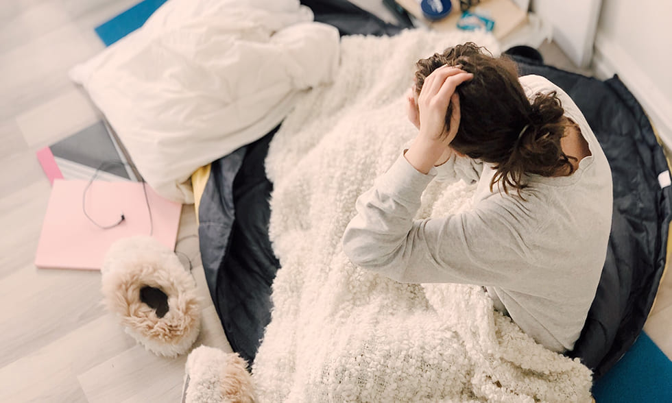 Title image: Woman wondering in bed: Why can't I sleep?