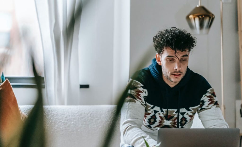 Title image: Man feeling overwhelmed in home office